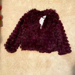 Fun, flirty textured jacket in a gorgeous maroon color.